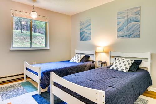 a bedroom with two beds and a window at Mountain Maryland Adventures Await in McHenry