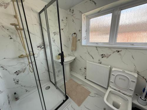 a bathroom with a shower and a sink at The cumbria place in Elswick