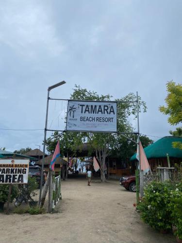 a sign that reads tamarapa beach resort in a parking lot at Tamara Beach Resort in Bailat