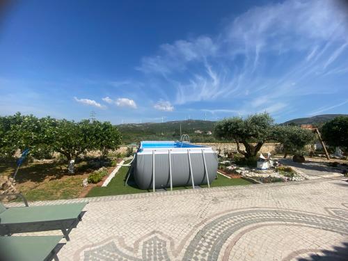 a view of a swimming pool in a park at Casa das Laranjeiras in Alqueidão da Serra