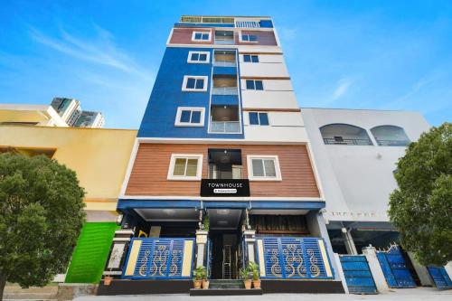 a building with a blue and white at Super Townhouse Hitech City Near Yashoda Hospital in Hyderabad