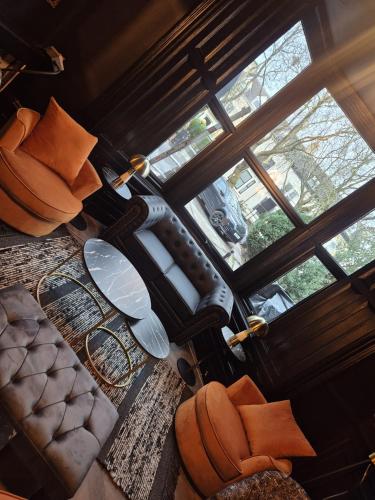 an overhead view of a living room with a large window at Hotel Eighteen92 in Liverpool