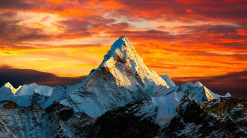 a snow covered mountain with a sunset in the background at Swift Homes in Kampala