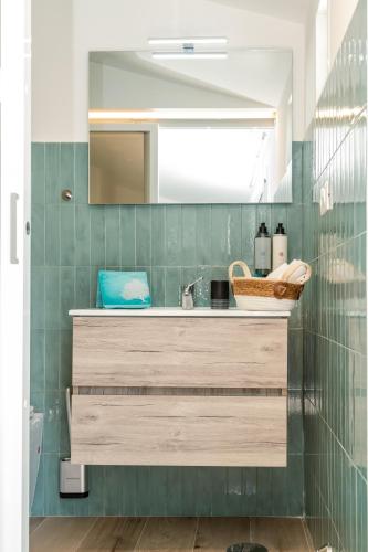 a bathroom with a sink and a mirror at Il borgo di Ulisse in Gaeta