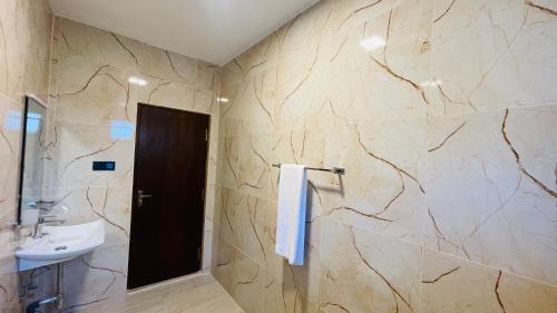 a bathroom with a sink and a toilet at seaside residence negombo in Negombo