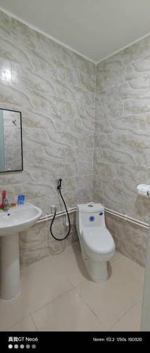 a bathroom with a toilet and a sink at Motel La Casbah in Constantine