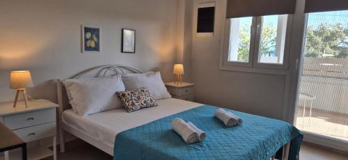 a bedroom with a bed with two pillows on it at Apartment K2 in Pyrgi