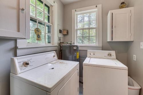 a white laundry room with a washer and dryer at Private Deck & Yard: Pet-Friendly Noble Getaway in Noble