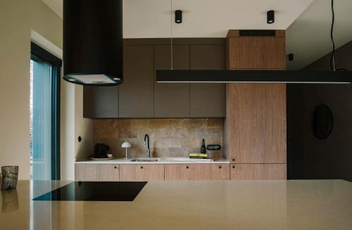 a kitchen with a sink and a counter top at Wolne Domy in Dominikowice