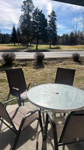 a table and two chairs and a table and chairs at Davis Beach Getaway Pet Friendly & Beach Access in McCall