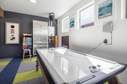 a living room with a large glass table in it at Cabin, Bonus Suite, Suncadia Pool Access in Cle Elum