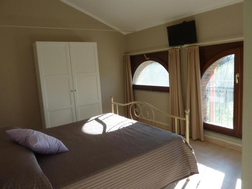Postel nebo postele na pokoji v ubytování Agriturismo Boschi Celati