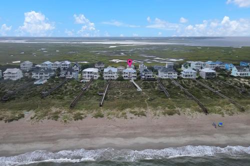 an aerial view of a resort on the beach at Surviving Stress by Oak Island Accommodations in Caswell Beach