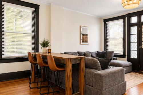 a living room with a couch and a table at Cozy Home near Downtown - Close to Nulu - Sleeps 6 in Louisville