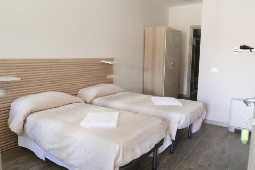 Postel nebo postele na pokoji v ubytování Agriturismo Boschi Celati