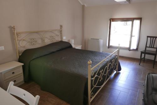 Postel nebo postele na pokoji v ubytování Agriturismo Boschi Celati