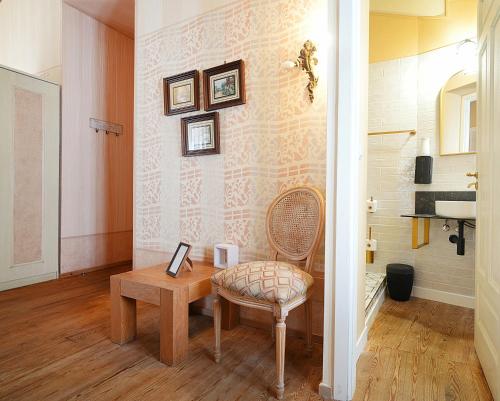a room with a wooden table and a chair and a table and a table at Guest house SAL E PEDRA in Villanueva de Arosa