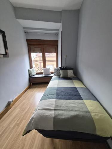 a bedroom with a large bed in a room at Espacio Yina Grado in Grado