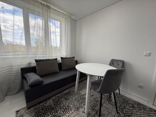 a living room with a couch and a table at Apartaments Briceni city in Briceni