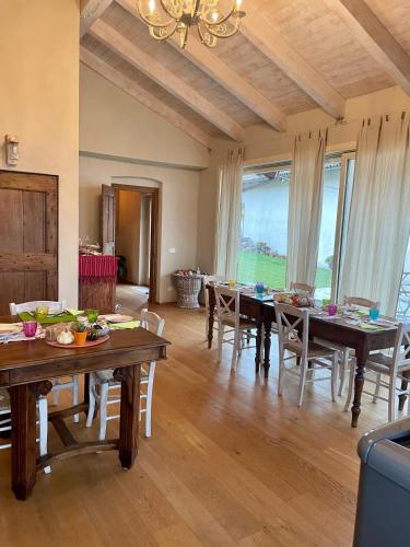 a dining room with a table and chairs at La Mela Antica in Cherasco