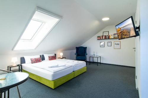 a bedroom with a large bed and a window at Wirtshaus Feininger Hof in Benz