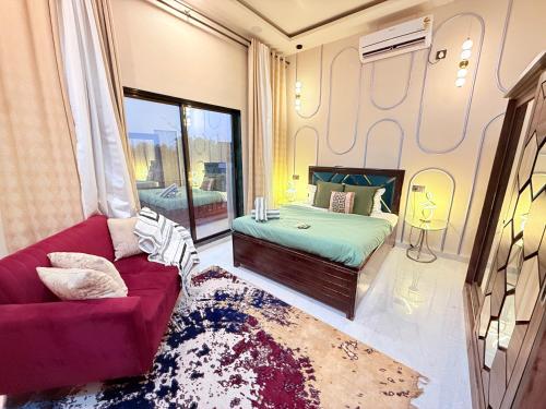a bedroom with a bed and a couch at AG ViLLA NERAL in Neral