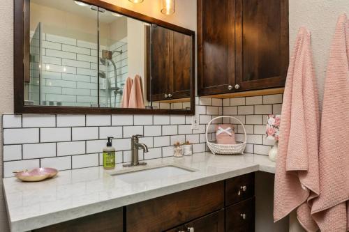 a bathroom with a sink and a mirror at Peaks View Bunk House in Hillsboro