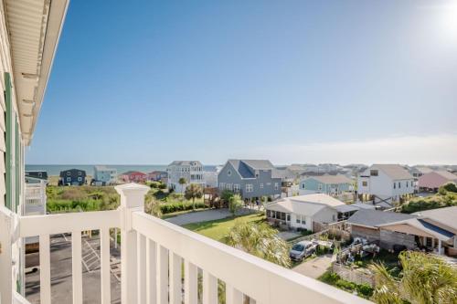 a view from the balcony of a house at The Island Sandpiper by Oak Island Accommodations in Oak Island