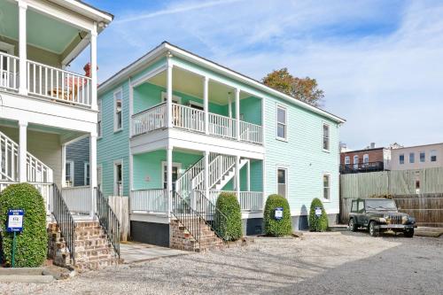 a green house with a white at Newly Renovated Steps to Bars & Restaurants in Charleston