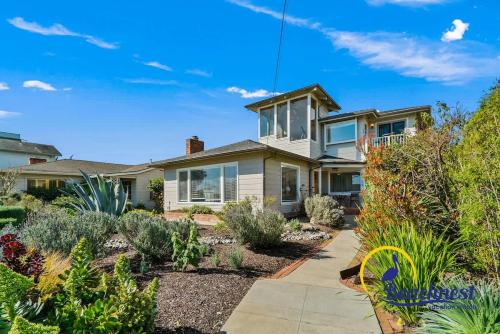 a house with a garden with plants at Opal Cliff Overlook in Santa Cruz