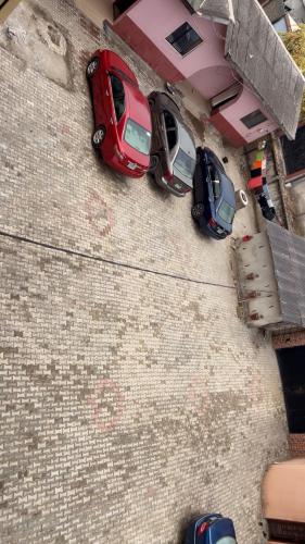 a group of cars parked on the side of a building at Rehoboth place in Awoyaya
