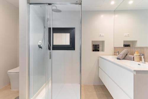 a bathroom with a shower and a sink at Los Naranjos House in Marbella