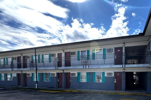 a building with balconies on the side of it at Briarwood Motel Near Valdosta University I 75 in Valdosta