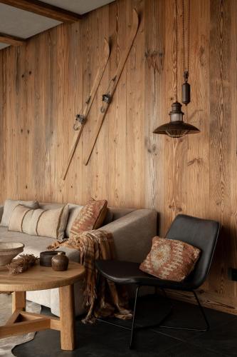 a living room with a couch and a table at Gorczański Lux Chalet in Szlembark