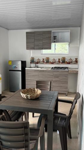 a kitchen with a table and chairs and a kitchen with a stove at Old Providence Paradise View in Providencia