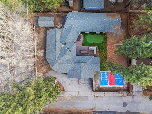 an overhead view of a house with a roof at Rare Indoor Pool, Game Room & Courts, 5 Blocks to Snow Summit in Big Bear Lake