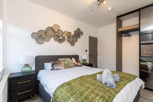 a bedroom with a large bed and a window at Sussex House 20 - Artistic Luxe 1 Bed Apartment in Horsham