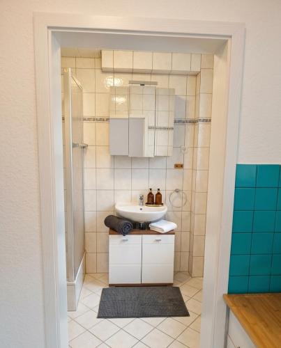 a bathroom with a sink and a shower at Apartment Julia in Bad Orb