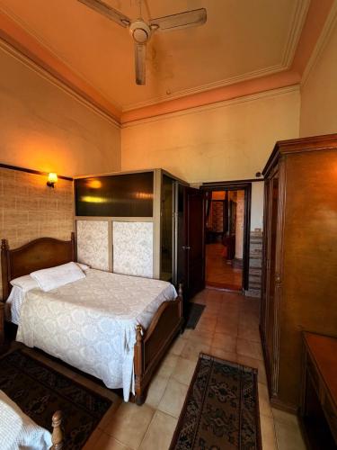 a bedroom with a large bed in a room at Fouad Hotel in Alexandria