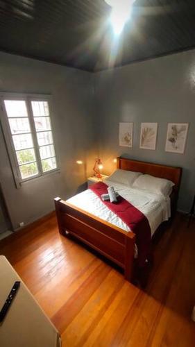 a bedroom with a bed in a room at Hospedagem 154 Colonial in Gramado