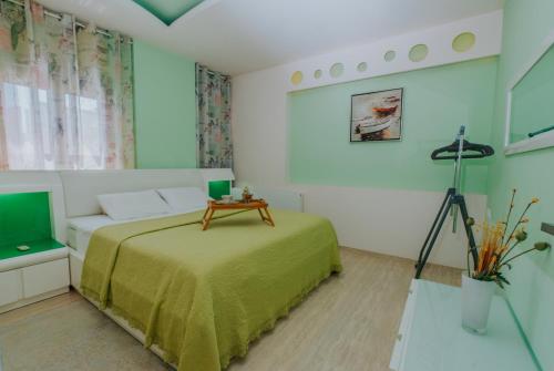 a bedroom with a bed and a television at Seaside suite in Crete in Kokkini Khanion