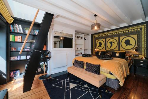 a bedroom with a bed and a book shelf at Le Boudoir in Lyon
