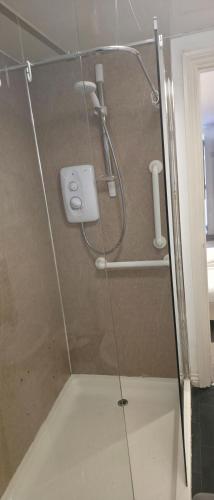 a shower with a glass door in a bathroom at West Beck House Newcastle - Private Double En-Suite in North Shields