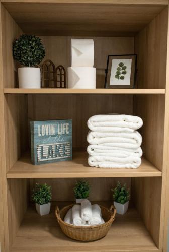 a shelf with towels and a basket of towels at Gold Mine Lofts in Idaho City
