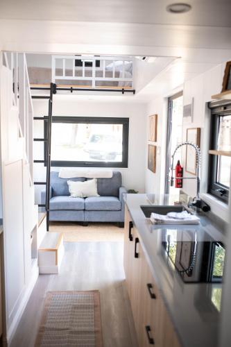 a kitchen and living room in a tiny house at Gold Mine Lofts in Idaho City