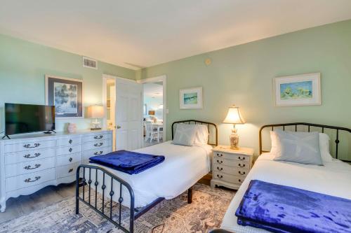 a bedroom with two beds and a tv at ‘Emerald Dreams’ Beach & Lakefront West PCB Condo in Panama City Beach