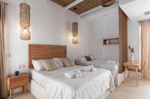 a bedroom with two beds with towels on them at EOS Gaeta in Gaeta