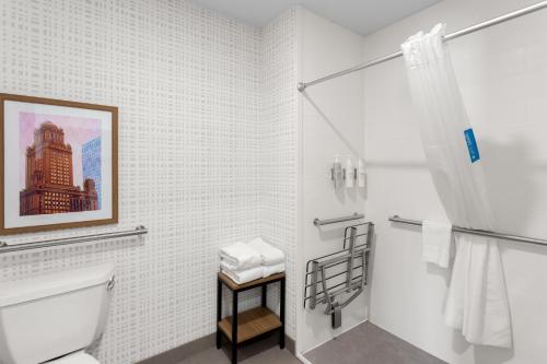 a white bathroom with a toilet and a shower at Hampton Inn & Suites Chicago Deer Park in Deer Park