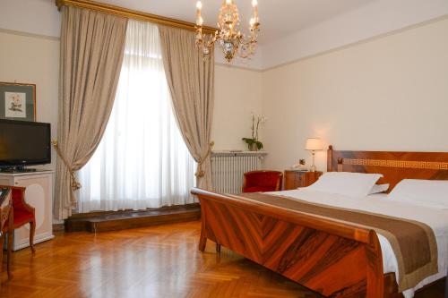 Ένα ή περισσότερα κρεβάτια σε δωμάτιο στο Hotel Vittoria