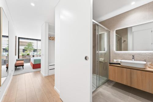 a bathroom with a sink and a mirror at Riva Waterfront in Olhão